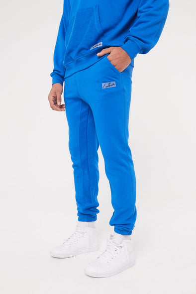 reverse-loopback-essentials-joggers-blue